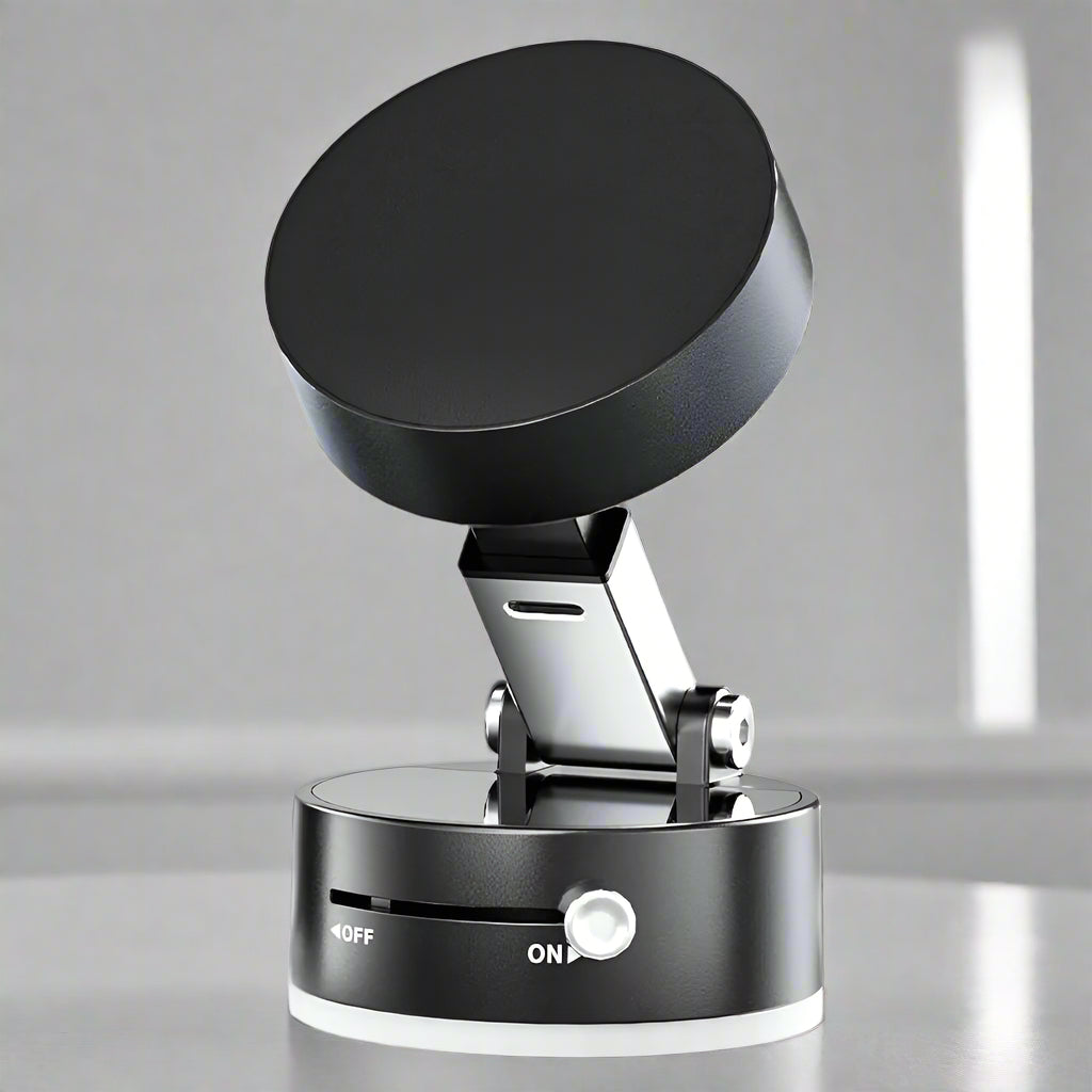 Black electronic device with a circular base and a cylindrical top on a white background