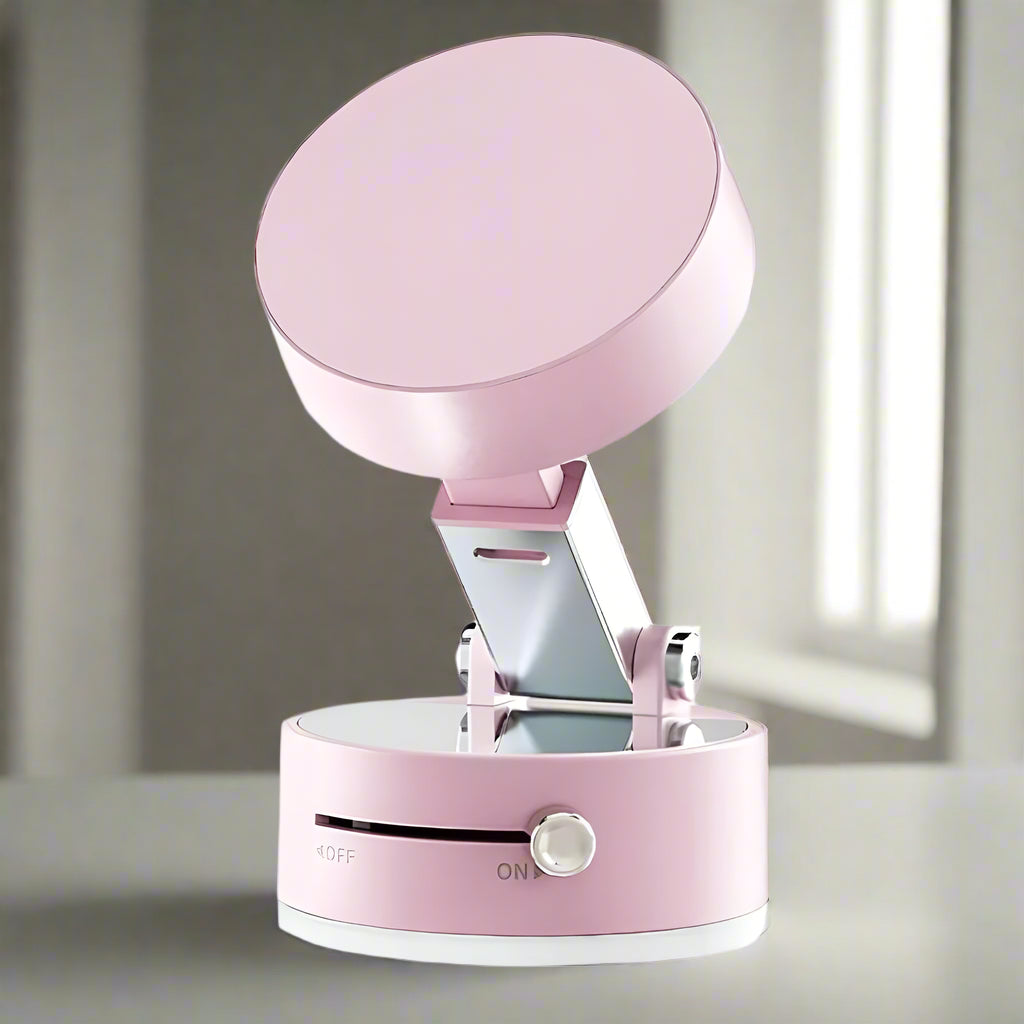 Pink phone stand with a round base and adjustable arm on a white background